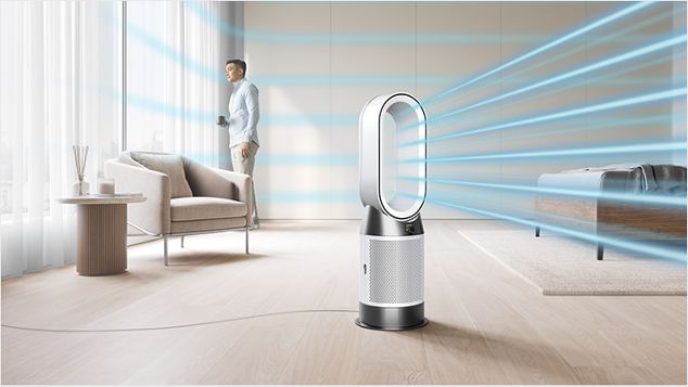 The Dyson Purifier Hot+Cool HP11 heating purifier delivering a cool breeze with purified air in a bedroom.