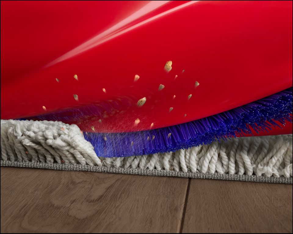Bristles on the brush bar agitating dust and debris out of carpet.